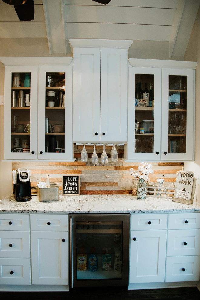 Inspiration for a large farmhouse l-shaped dark wood floor open concept kitchen remodel in Atlanta with an undermount sink, shaker cabinets, white cabinets, granite countertops, gray backsplash, ceramic backsplash, stainless steel appliances, an island and white countertops