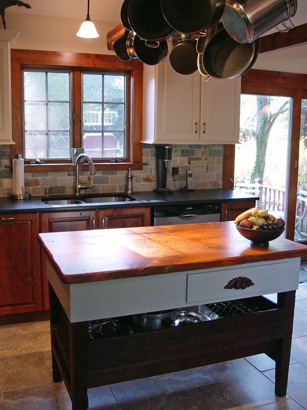 Mid-sized farmhouse l-shaped slate floor eat-in kitchen photo in Providence with a double-bowl sink, recessed-panel cabinets, white cabinets, wood countertops, multicolored backsplash, porcelain backsplash, an island and stainless steel appliances