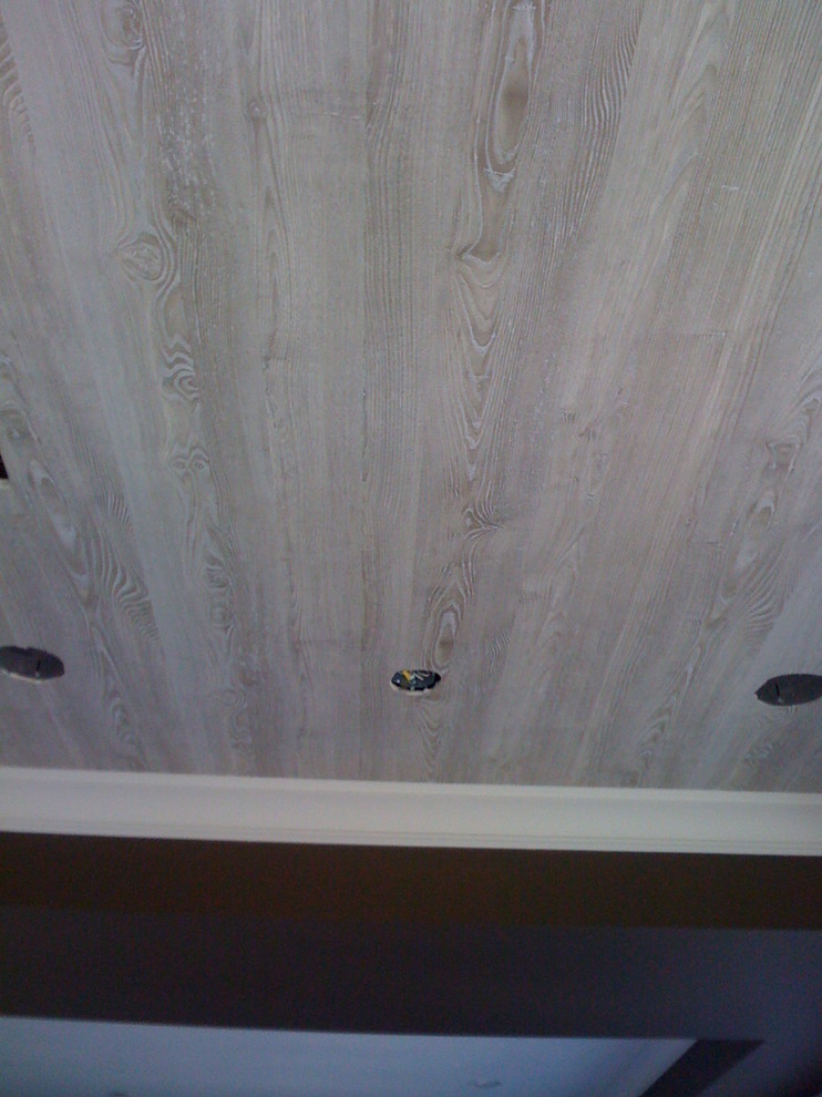 Faux wood wallpaper on a ceiling. This wallpaper from France really did