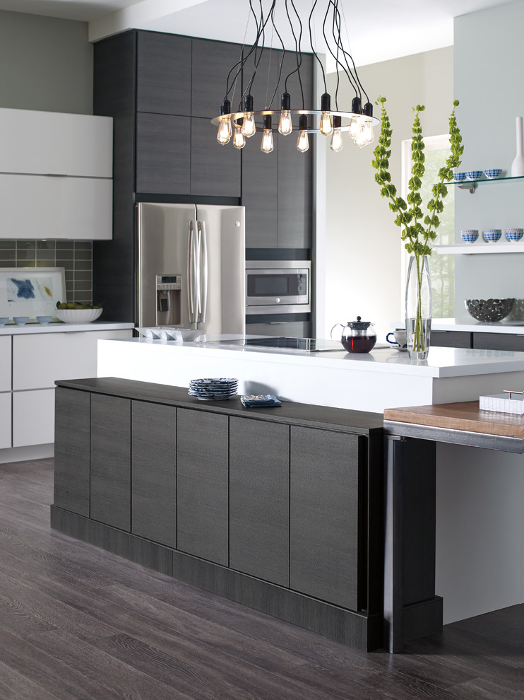 Inspiration for a large contemporary dark wood floor kitchen remodel in Detroit with an undermount sink, flat-panel cabinets, black cabinets, quartz countertops, gray backsplash, ceramic backsplash, stainless steel appliances and an island