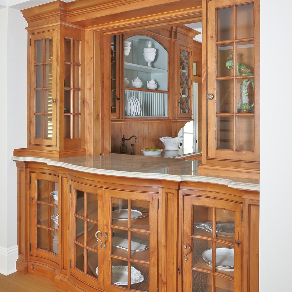 Photo of a medium sized classic u-shaped enclosed kitchen in Miami with a submerged sink, beaded cabinets, medium wood cabinets, wood worktops, blue splashback, integrated appliances and concrete flooring.