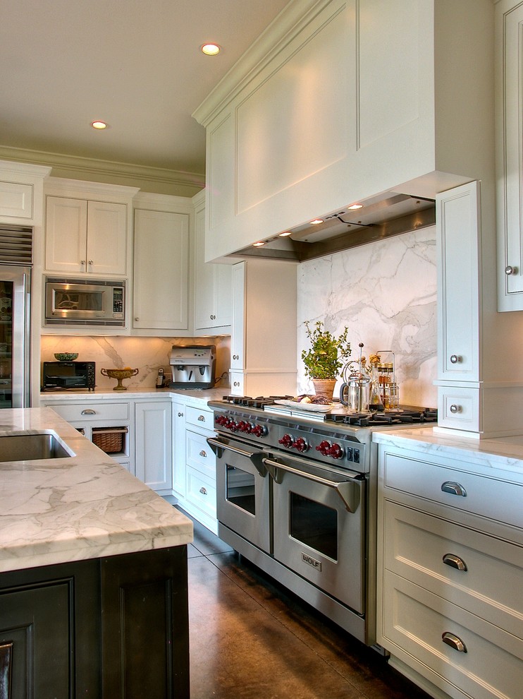 Inspiration for a timeless kitchen remodel in Seattle with marble countertops, stainless steel appliances and marble backsplash