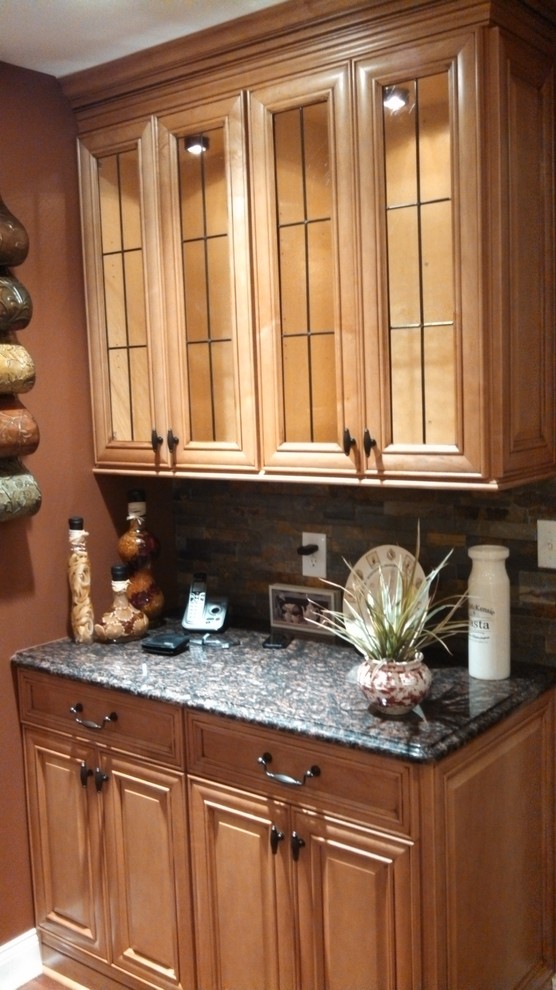 Photo of a medium sized traditional kitchen in Philadelphia with glass-front cabinets.