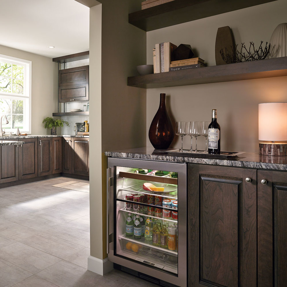 Inspiration for a large transitional open concept kitchen remodel in Other with an undermount sink, raised-panel cabinets, dark wood cabinets, yellow backsplash, stainless steel appliances and a peninsula