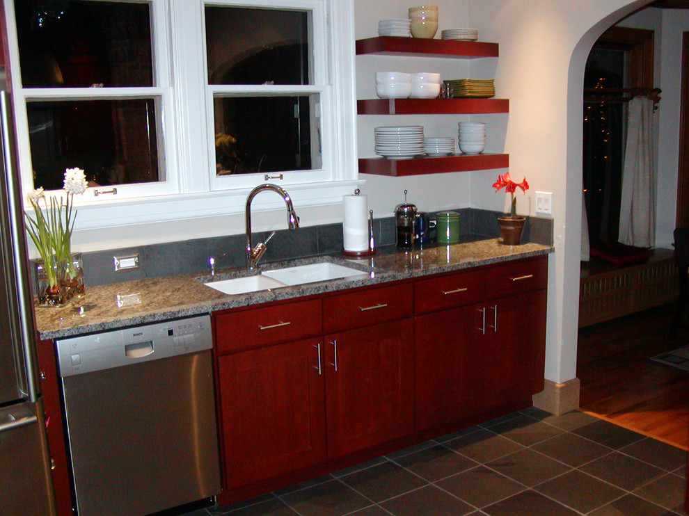 This is an example of a medium sized contemporary l-shaped enclosed kitchen in Orange County with a double-bowl sink, recessed-panel cabinets, red cabinets, engineered stone countertops, grey splashback, ceramic splashback, stainless steel appliances, ceramic flooring and no island.