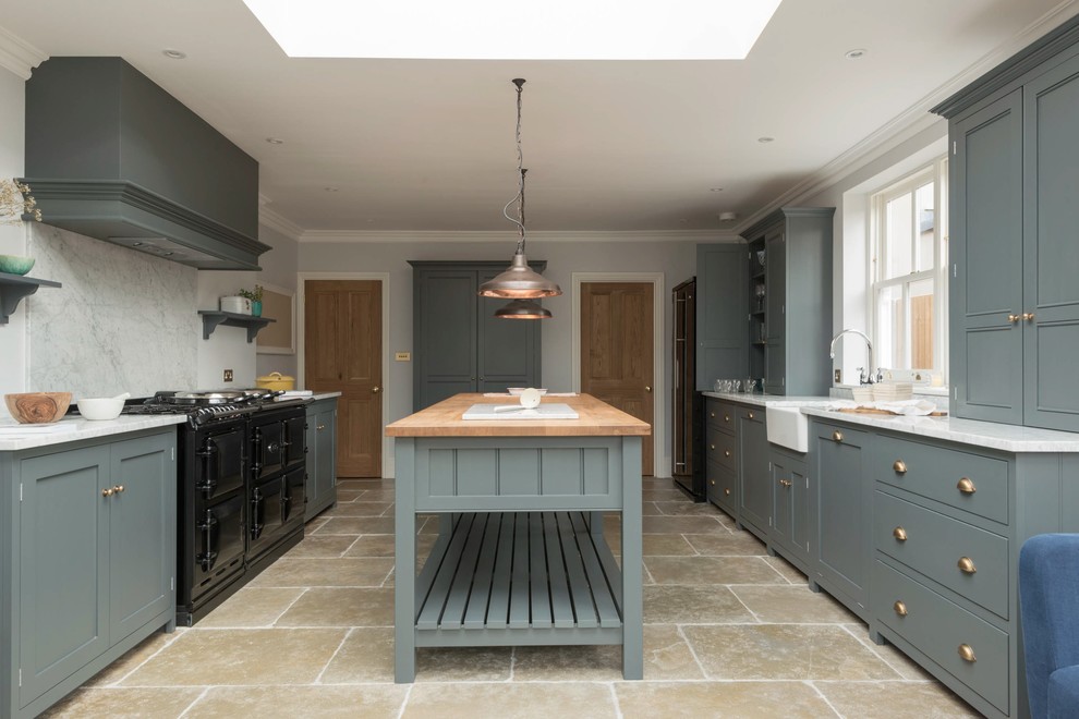 Inspiration for a large farmhouse enclosed kitchen in Other with shaker cabinets, grey cabinets, marble worktops, white splashback, black appliances, limestone flooring and an island.