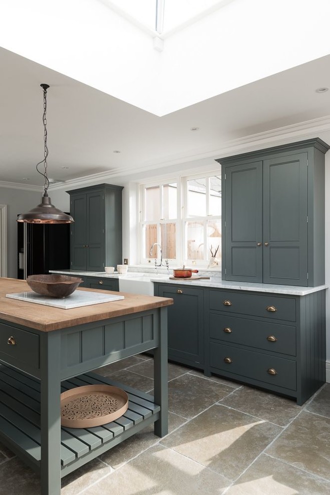 Design ideas for a large farmhouse enclosed kitchen in Other with shaker cabinets, grey cabinets, marble worktops, white splashback, black appliances, limestone flooring and an island.
