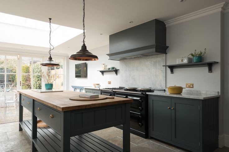 Photo of a large farmhouse enclosed kitchen in Other with shaker cabinets, grey cabinets, marble worktops, white splashback, black appliances, limestone flooring and an island.