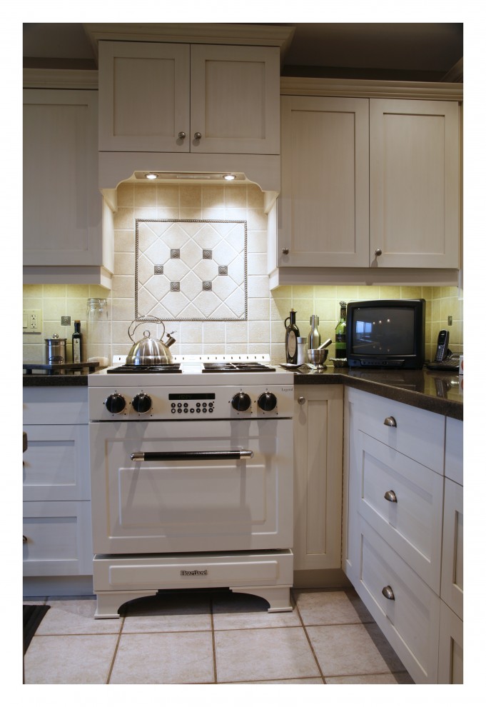 Elegant kitchen photo in Toronto with white appliances