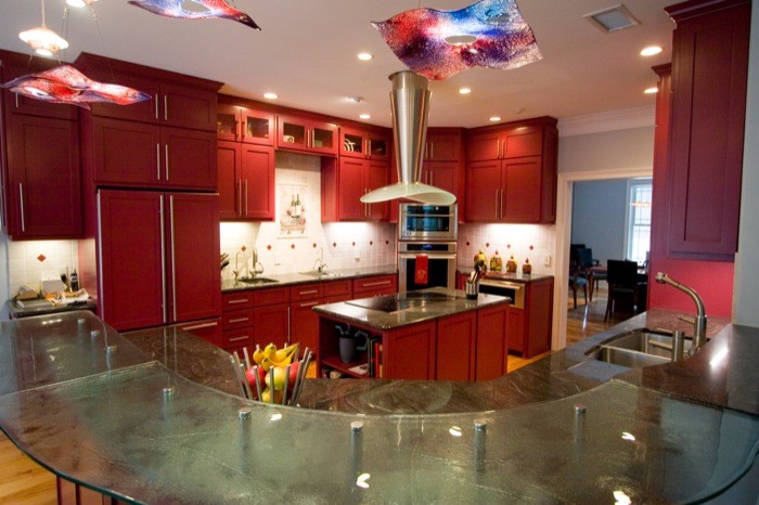 Inspiration for a large eclectic light wood floor enclosed kitchen remodel in Wilmington with a double-bowl sink, shaker cabinets, red cabinets, granite countertops, white backsplash, stainless steel appliances and an island