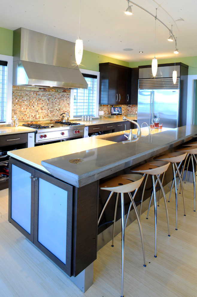 Photo of a contemporary kitchen in Boston with a double-bowl sink, flat-panel cabinets, dark wood cabinets, engineered stone countertops, multi-coloured splashback, stainless steel appliances, light hardwood flooring and multiple islands.