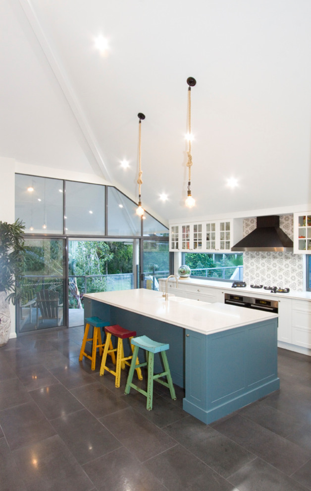 Large classic open plan kitchen in Brisbane with shaker cabinets, engineered stone countertops and ceramic splashback.