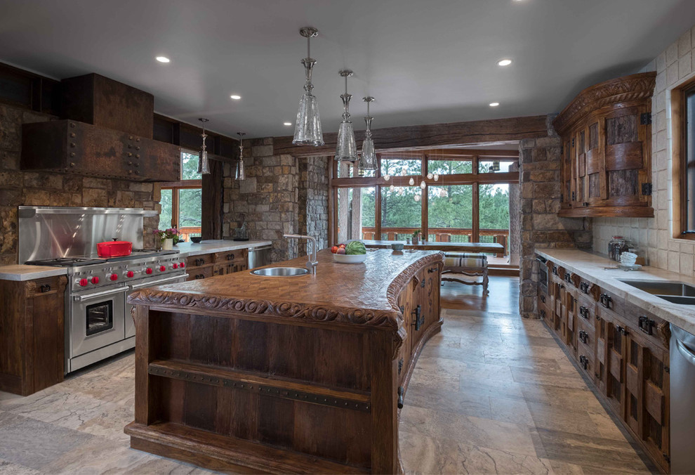 Example of a large mountain style galley ceramic tile eat-in kitchen design in Phoenix with a double-bowl sink, medium tone wood cabinets, stainless steel appliances, an island, recessed-panel cabinets, wood countertops, multicolored backsplash and stone tile backsplash