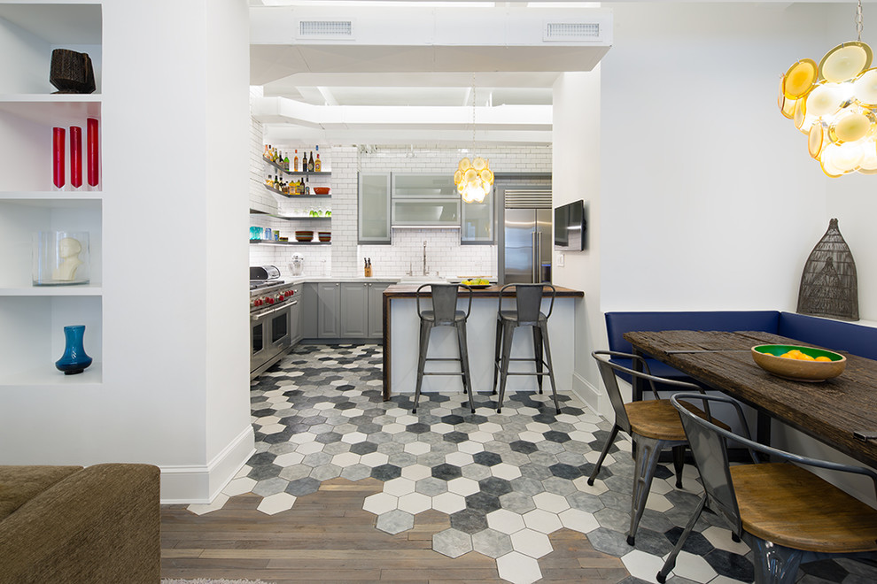 Kitchen - mid-sized contemporary ceramic tile kitchen idea in New York with an island