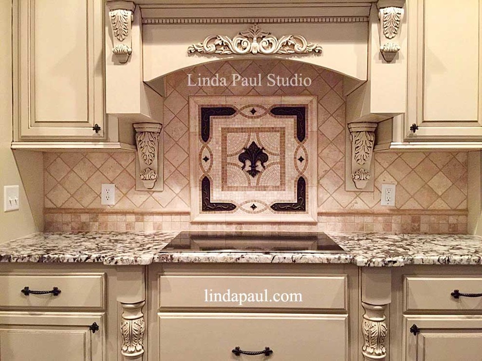 Elegant kitchen photo in Denver with raised-panel cabinets, beige cabinets, granite countertops, beige backsplash and stone tile backsplash