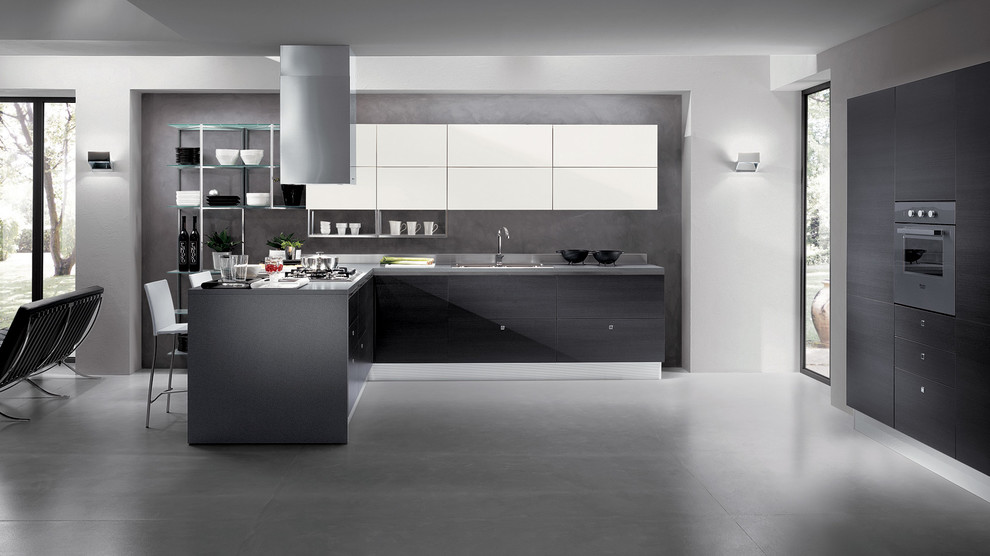 Example of a large minimalist l-shaped concrete floor eat-in kitchen design in Melbourne with a double-bowl sink, raised-panel cabinets, black cabinets, stainless steel countertops, metallic backsplash, metal backsplash, black appliances and two islands