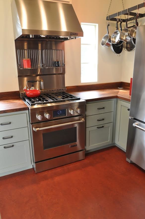 Kitchen - small eclectic l-shaped linoleum floor kitchen idea in Phoenix with shaker cabinets, white cabinets, wood countertops, metallic backsplash, metal backsplash and stainless steel appliances