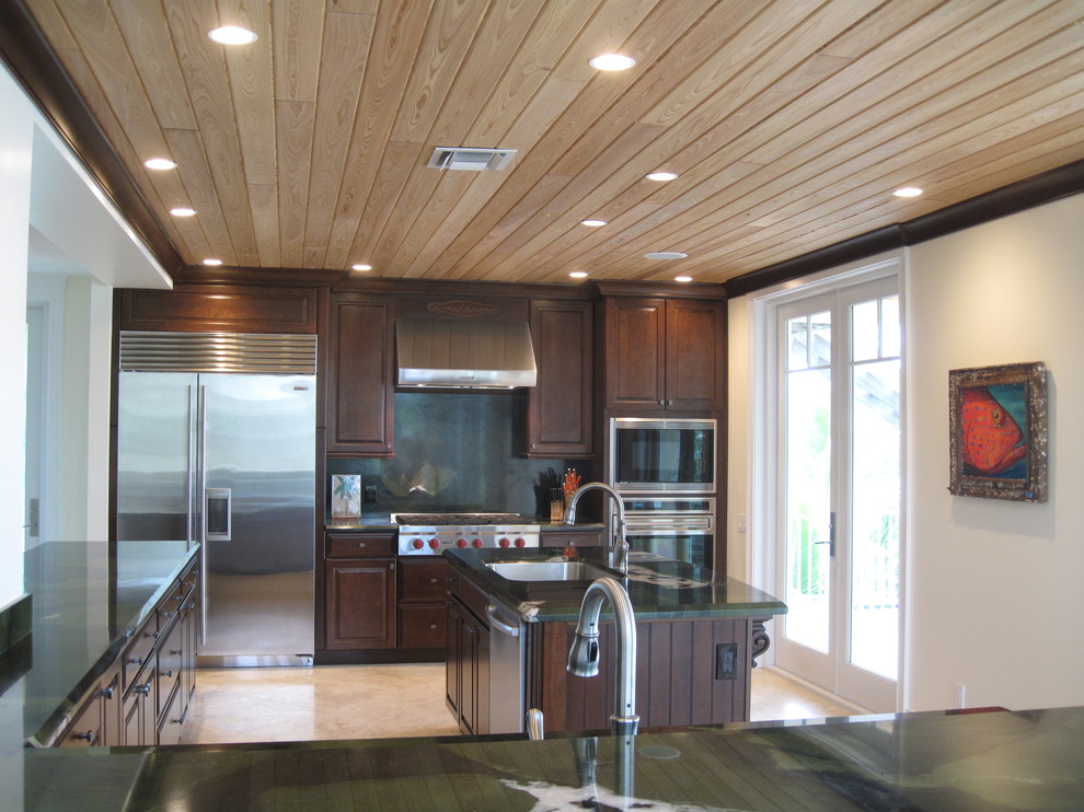Example of an island style kitchen design in Miami