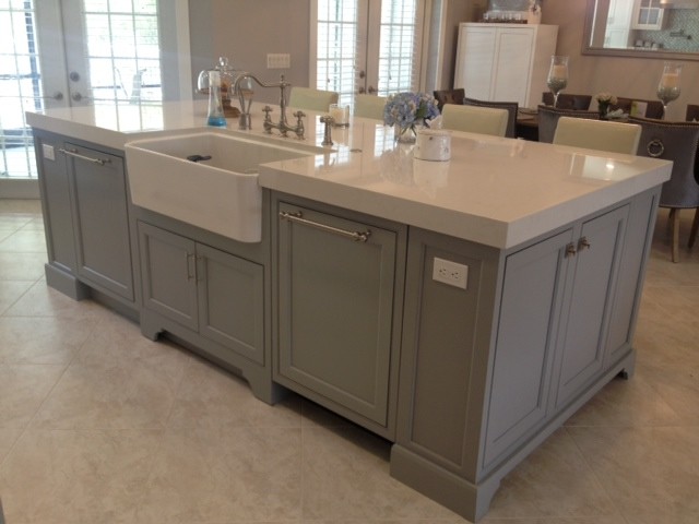 Example of a mid-sized transitional galley enclosed kitchen design in Miami with an undermount sink, beaded inset cabinets, white cabinets, blue backsplash, glass tile backsplash, stainless steel appliances and an island