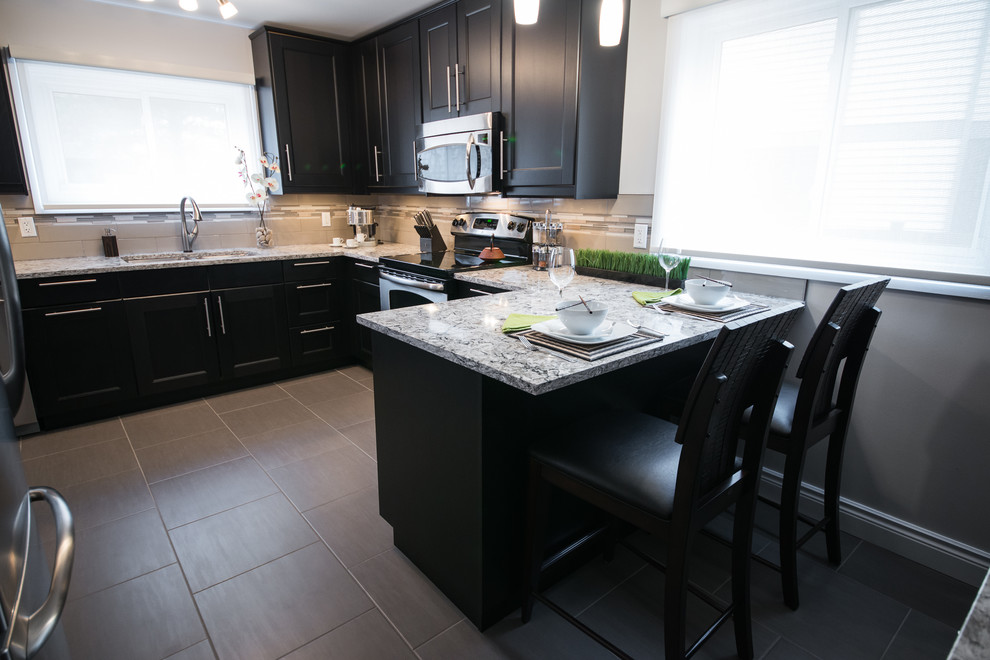 Transitional porcelain tile eat-in kitchen photo in Ottawa with an undermount sink, recessed-panel cabinets, quartz countertops, glass tile backsplash and stainless steel appliances
