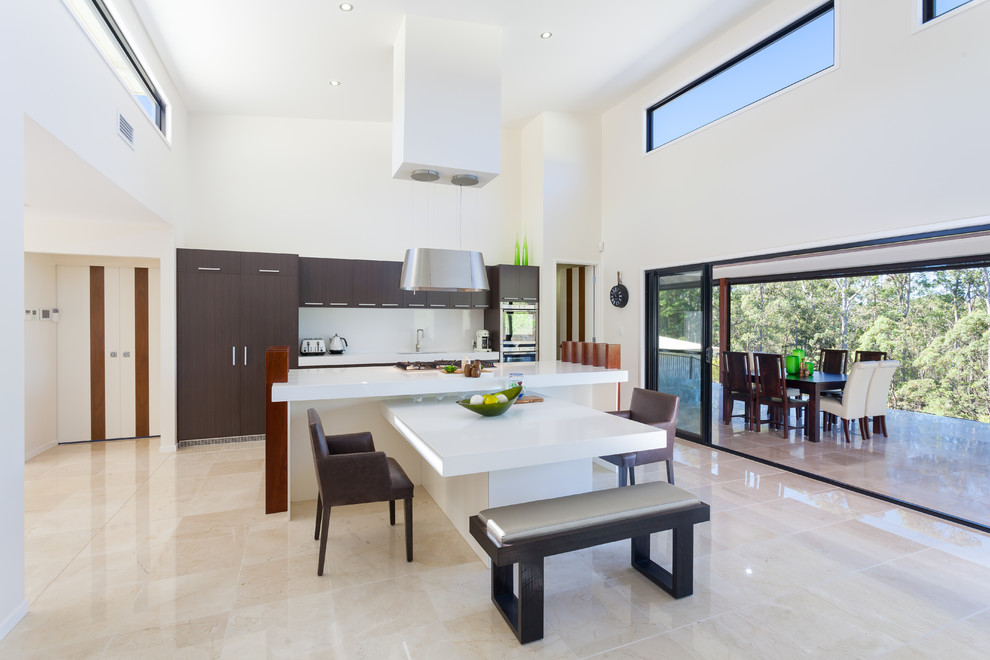Inspiration for a contemporary marble floor kitchen remodel in Brisbane with an undermount sink, flat-panel cabinets, dark wood cabinets, quartz countertops, white backsplash, stone slab backsplash, stainless steel appliances and two islands