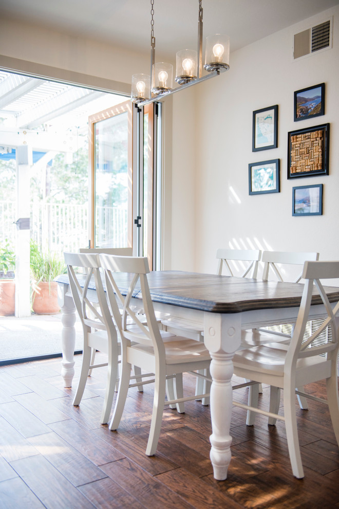 Photo of a large country kitchen/dining room in Los Angeles with medium hardwood flooring.