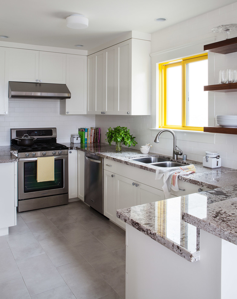 Example of a small trendy ceramic tile eat-in kitchen design in San Francisco with an undermount sink, shaker cabinets, white cabinets, granite countertops, white backsplash, ceramic backsplash, stainless steel appliances and no island