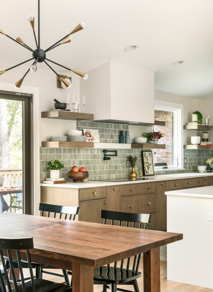Large 1950s l-shaped medium tone wood floor and vaulted ceiling eat-in kitchen photo in Nashville with an undermount sink, flat-panel cabinets, medium tone wood cabinets, quartz countertops, green backsplash, porcelain backsplash, stainless steel appliances, an island and white countertops