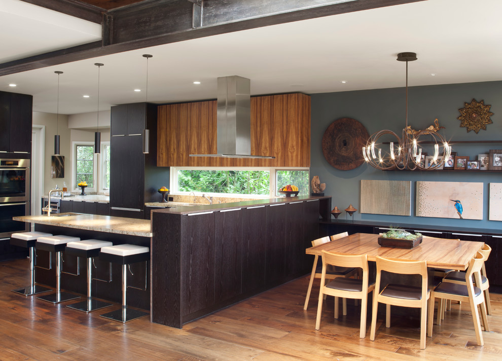 Design ideas for a contemporary kitchen in San Francisco with granite worktops, flat-panel cabinets and dark wood cabinets.