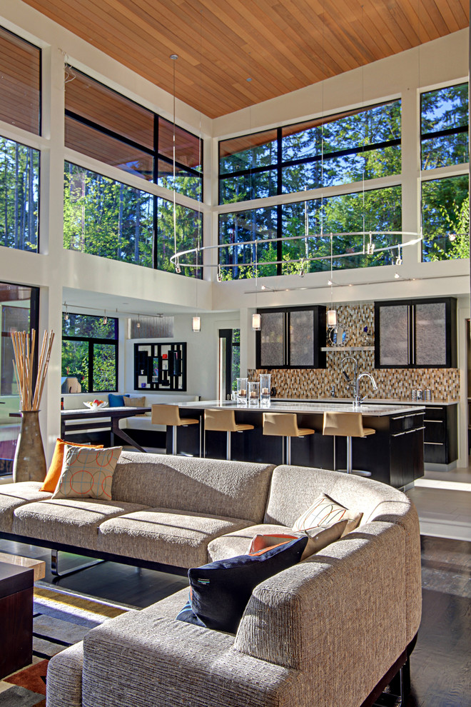 This is an example of a contemporary open plan kitchen in Seattle.