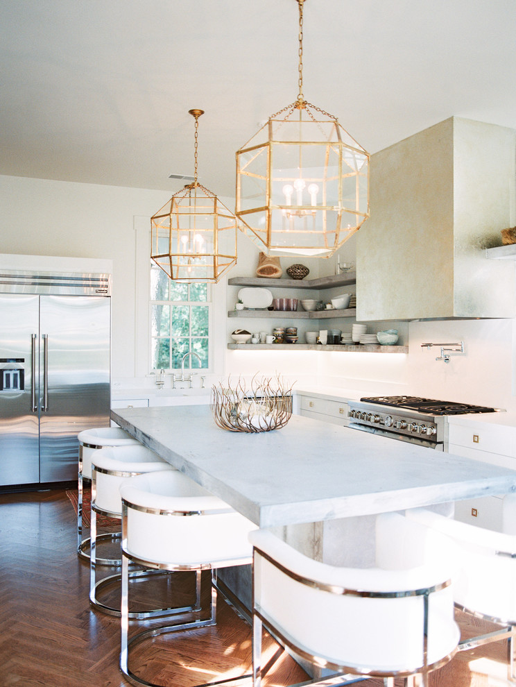 Example of a large trendy u-shaped medium tone wood floor eat-in kitchen design in Other with a farmhouse sink, white cabinets, white backsplash, stainless steel appliances, an island, open cabinets and quartz countertops