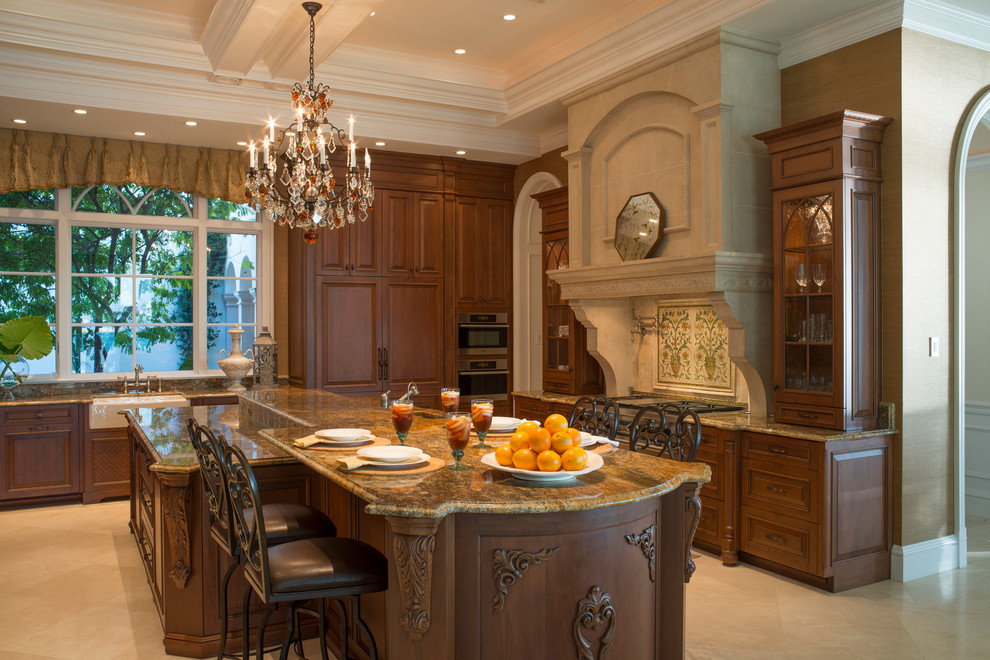 Example of a large classic l-shaped porcelain tile eat-in kitchen design in Miami with a farmhouse sink, raised-panel cabinets, dark wood cabinets, stainless steel appliances, an island, granite countertops and multicolored backsplash