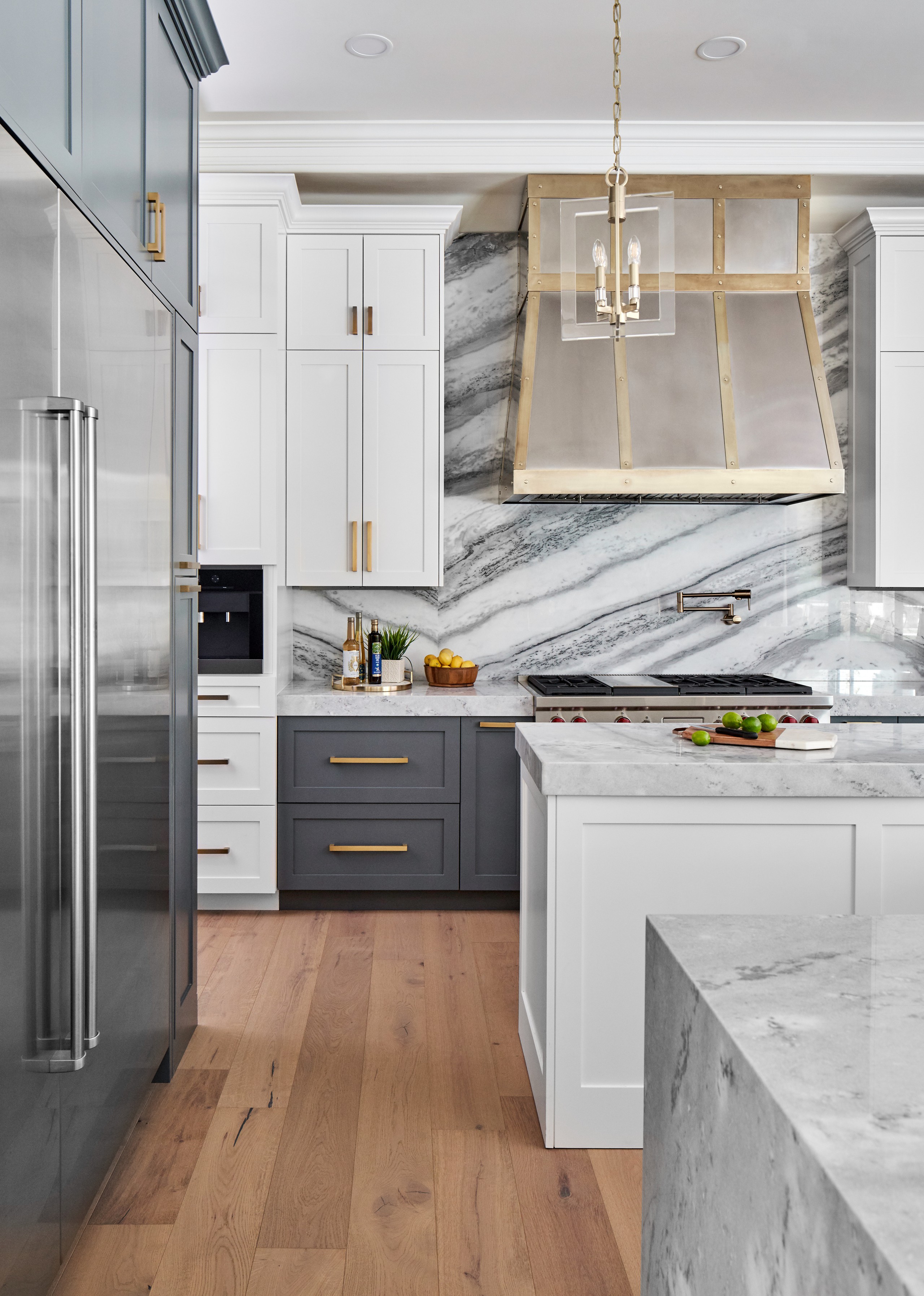 Transitional Kitchen with Marble Backsplash and Stainless Steel Range Hood