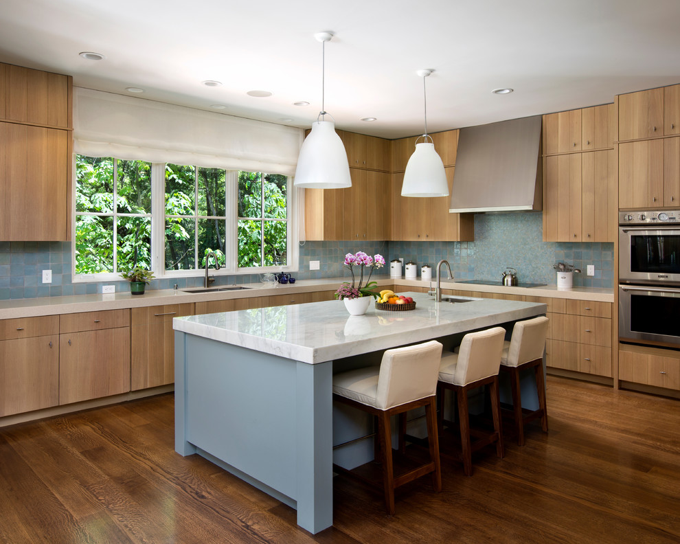 Kitchen - transitional kitchen idea in San Francisco with mosaic tile backsplash, stainless steel appliances, blue backsplash, flat-panel cabinets and medium tone wood cabinets