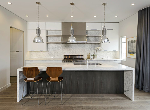 Compact industrial kitchen showing light reflection on high-gloss acrylic doors