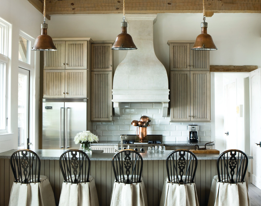 Example of a small farmhouse galley kitchen design in Atlanta with light wood cabinets, white backsplash, subway tile backsplash, stainless steel appliances, a peninsula, louvered cabinets and granite countertops