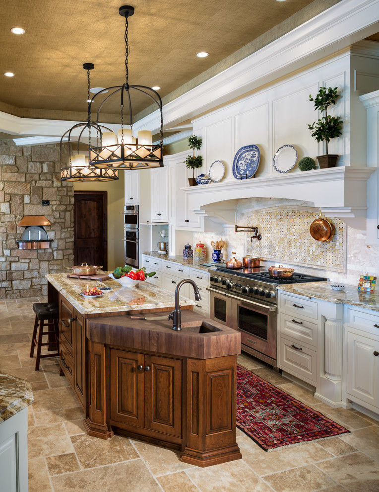 Eclectic kitchen photo in Milwaukee with raised-panel cabinets, white cabinets and stainless steel appliances