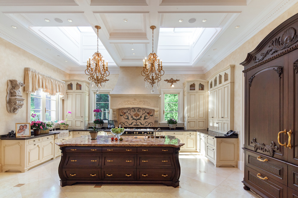 Eat-in kitchen - huge mediterranean u-shaped travertine floor eat-in kitchen idea in Chicago with paneled appliances, an island, a farmhouse sink, raised-panel cabinets, light wood cabinets, onyx countertops and multicolored backsplash
