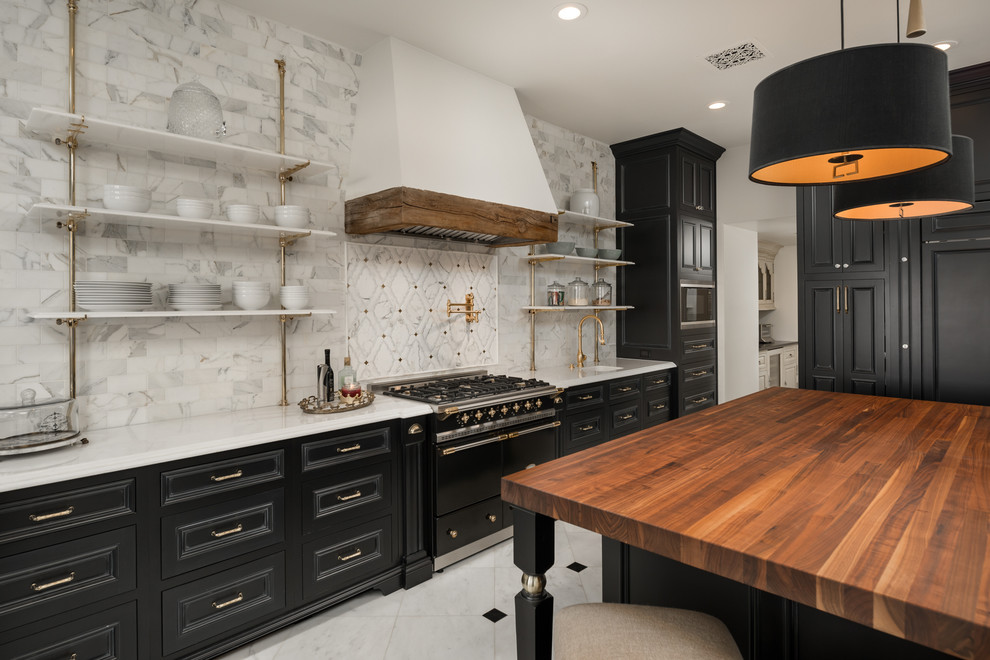 Example of a huge cottage chic u-shaped porcelain tile and multicolored floor eat-in kitchen design in Phoenix with an undermount sink, recessed-panel cabinets, black cabinets, wood countertops, multicolored backsplash, porcelain backsplash, paneled appliances, an island and multicolored countertops