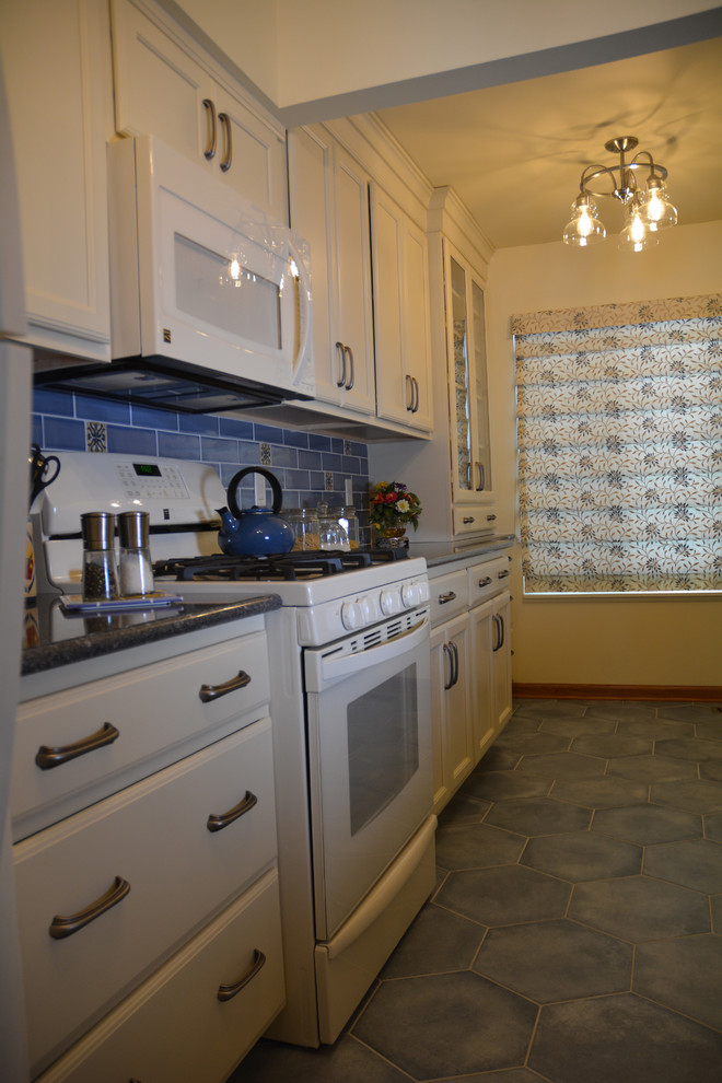 Small tuscan galley ceramic tile and blue floor eat-in kitchen photo in Other with an undermount sink, flat-panel cabinets, beige cabinets, quartz countertops, blue backsplash, ceramic backsplash, white appliances, no island and gray countertops