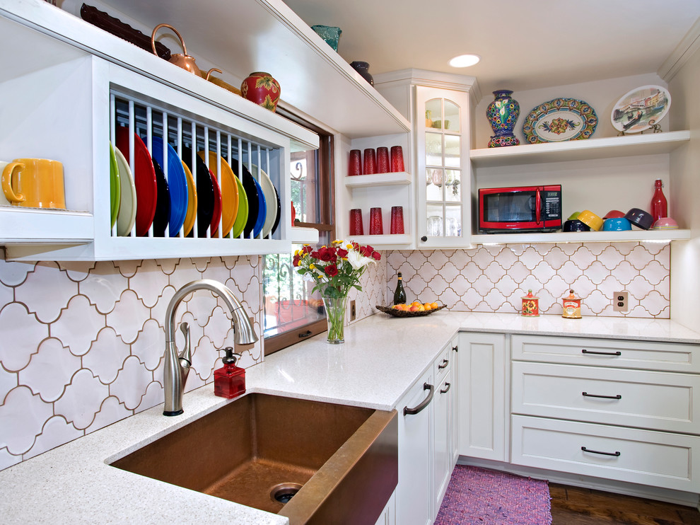 Example of an eclectic kitchen design in Austin with white backsplash, white cabinets, a farmhouse sink and recessed-panel cabinets