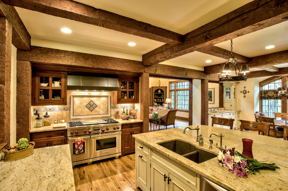 Example of a french country kitchen design in Cleveland with stainless steel appliances