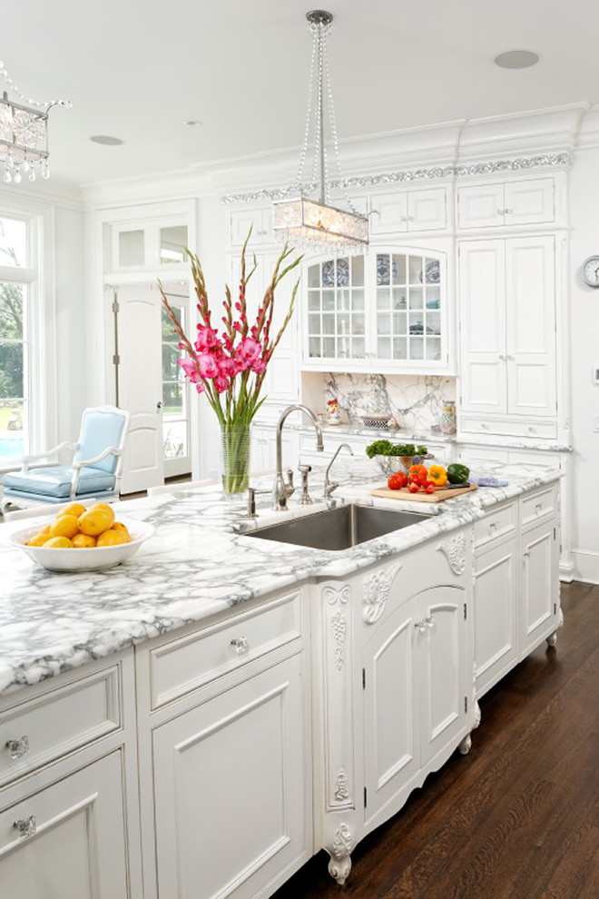 Kitchen - traditional kitchen idea in DC Metro with beaded inset cabinets, marble countertops, white cabinets, a single-bowl sink, white backsplash and stone slab backsplash