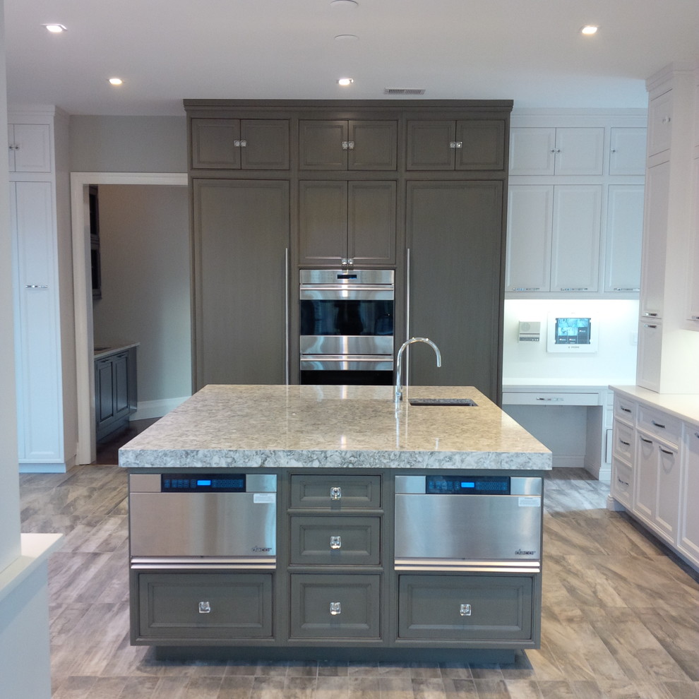 Mid-sized transitional l-shaped porcelain tile and brown floor eat-in kitchen photo in New York with an undermount sink, beaded inset cabinets, white cabinets, white backsplash, stainless steel appliances, an island and granite countertops