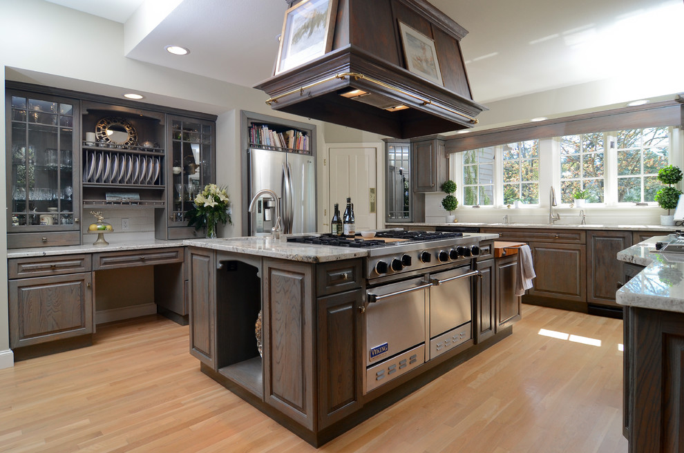 Large elegant light wood floor eat-in kitchen photo in Portland with a double-bowl sink, raised-panel cabinets, gray cabinets, granite countertops, white backsplash, porcelain backsplash, stainless steel appliances and an island