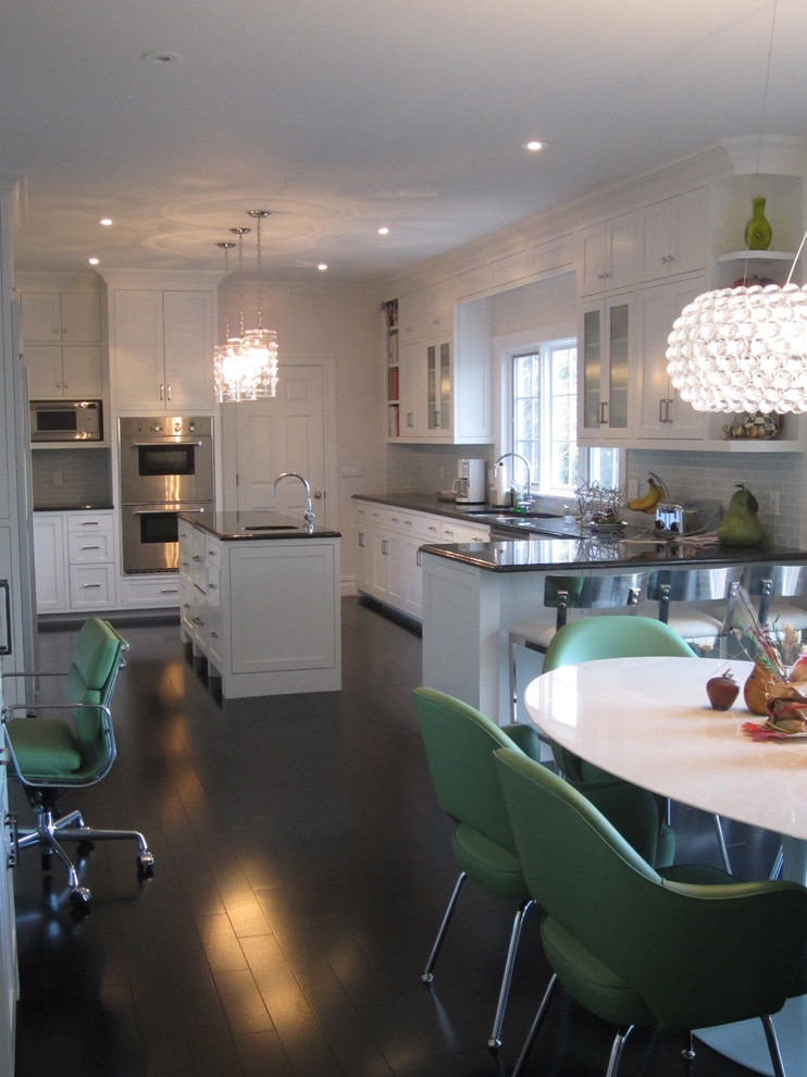 Example of a trendy kitchen design in New York with shaker cabinets and stainless steel appliances