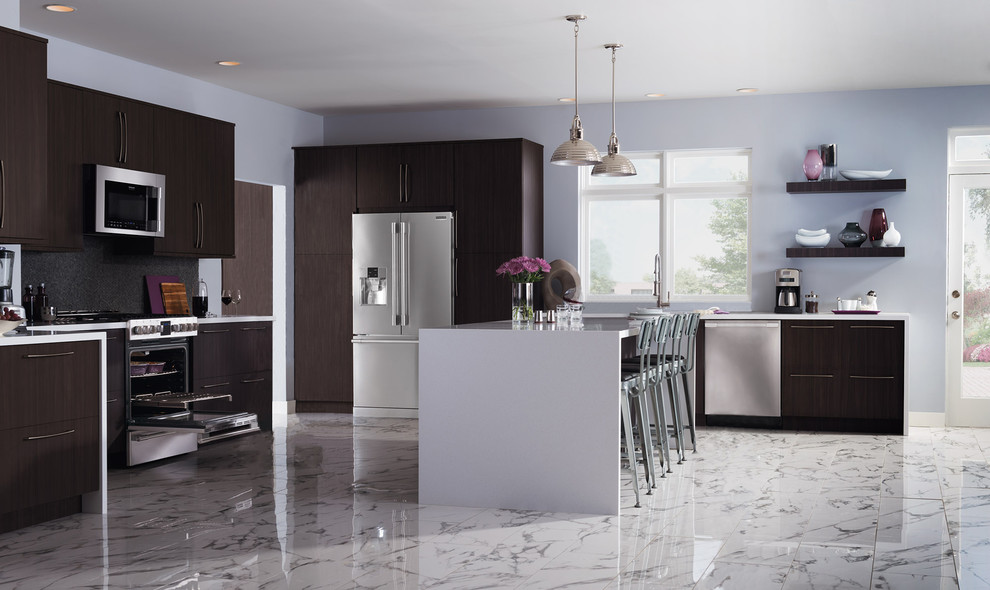Eat-in kitchen - large modern l-shaped marble floor eat-in kitchen idea in New York with an undermount sink, flat-panel cabinets, dark wood cabinets, solid surface countertops, black backsplash, porcelain backsplash, stainless steel appliances and an island