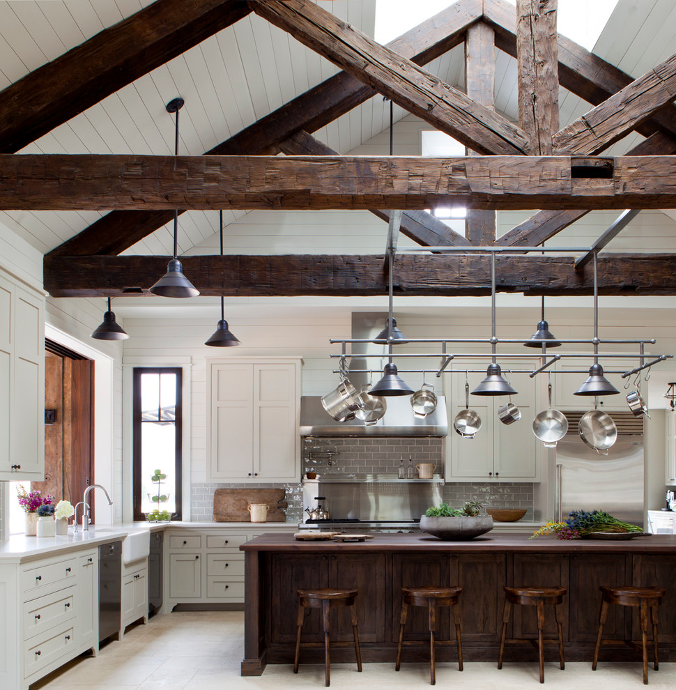 Large farmhouse u-shaped open concept kitchen photo in Austin with gray backsplash, subway tile backsplash, an island and shaker cabinets