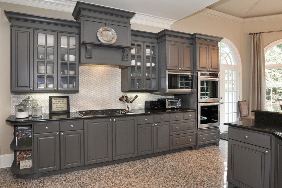 Medium sized classic u-shaped kitchen pantry in Atlanta with a built-in sink, raised-panel cabinets, grey cabinets, granite worktops, grey splashback, stone tiled splashback, stainless steel appliances, marble flooring and an island.