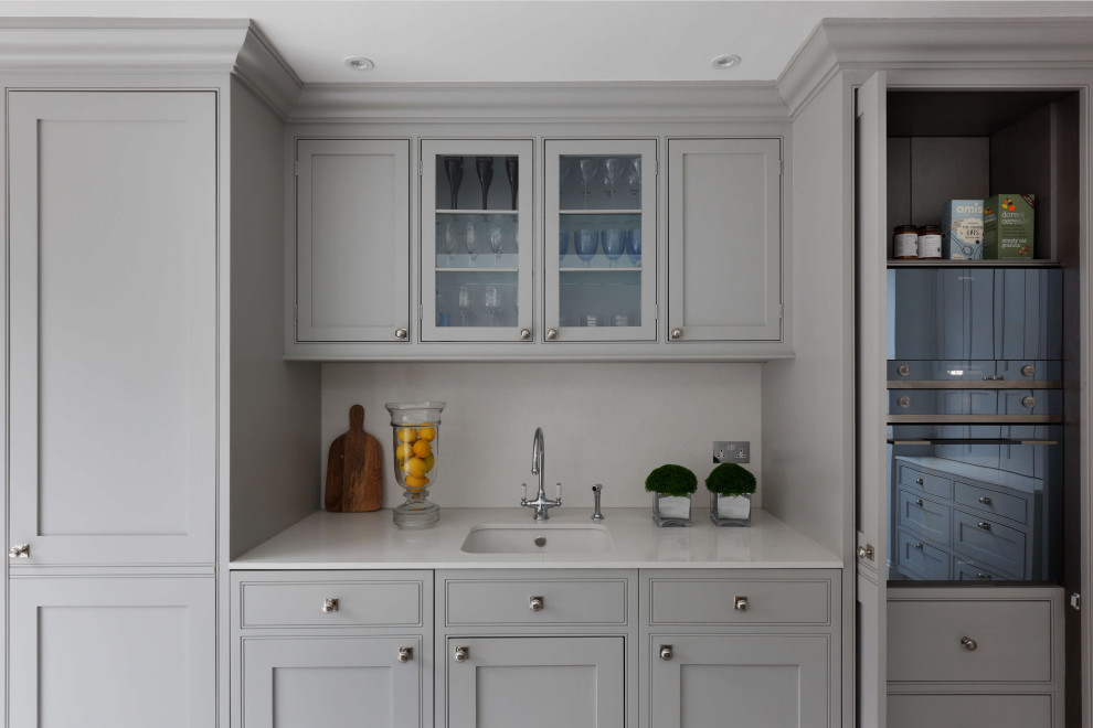 Design ideas for a large classic kitchen/diner in London with an island, white splashback, shaker cabinets, grey cabinets, marble worktops, marble splashback, stainless steel appliances, grey worktops and a built-in sink.